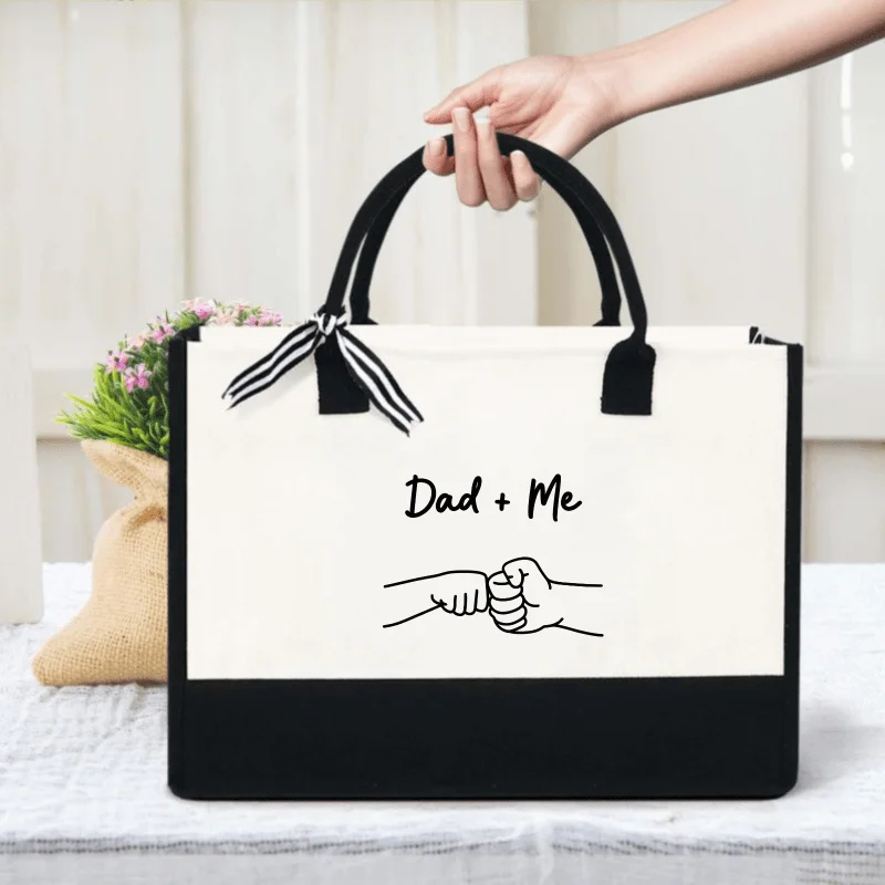 Cream and black canvas tote bag, printed with father and child boxing design, suitable for father and son to go out.