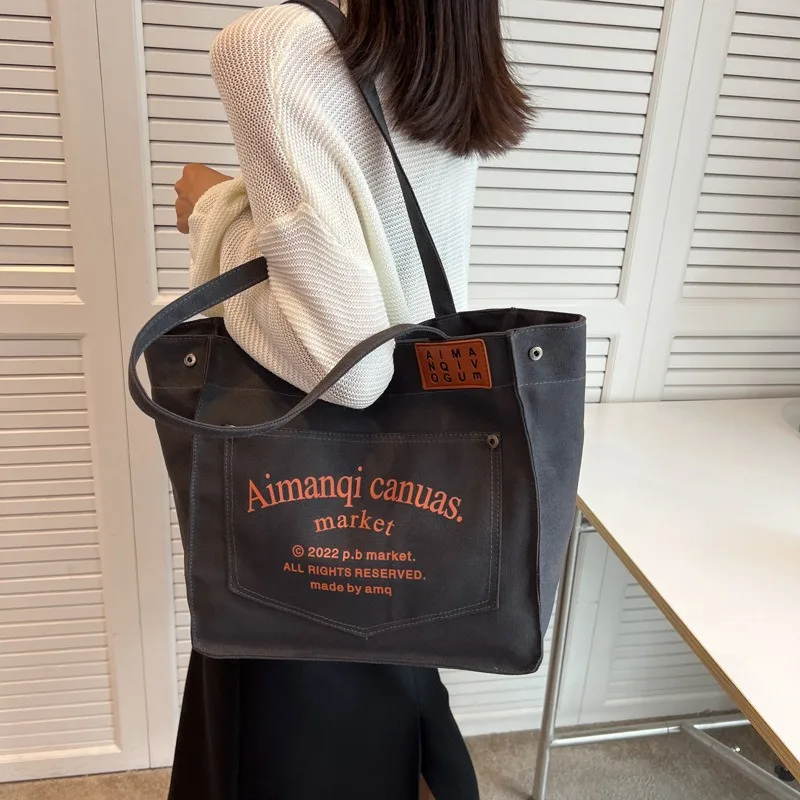 

New high-capacity portable storage bag, simple canvas solid color Korean tote bag, versatile women's shoulder bag for commuting