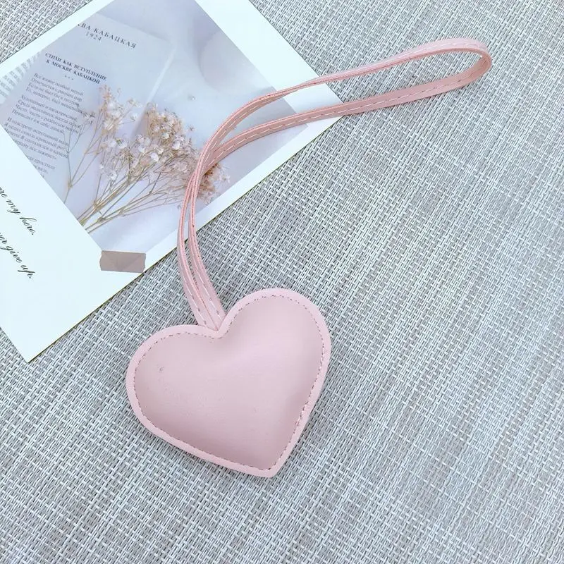 New niche leather peach heart hand rope pendant simple bag pendant car keychain couple backpack accessories fashion keychain