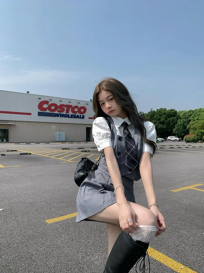 2025 été nouvelle mode femmes corée uniforme style jk robe ensemble gilet chemise courte plissée a-ligne jupe trois pièces jk ensemble