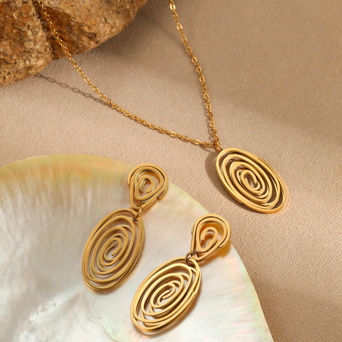 Hollow spiral vortex pendant necklace stainless steel earrings plated 18K gold jewelry set direct sales
