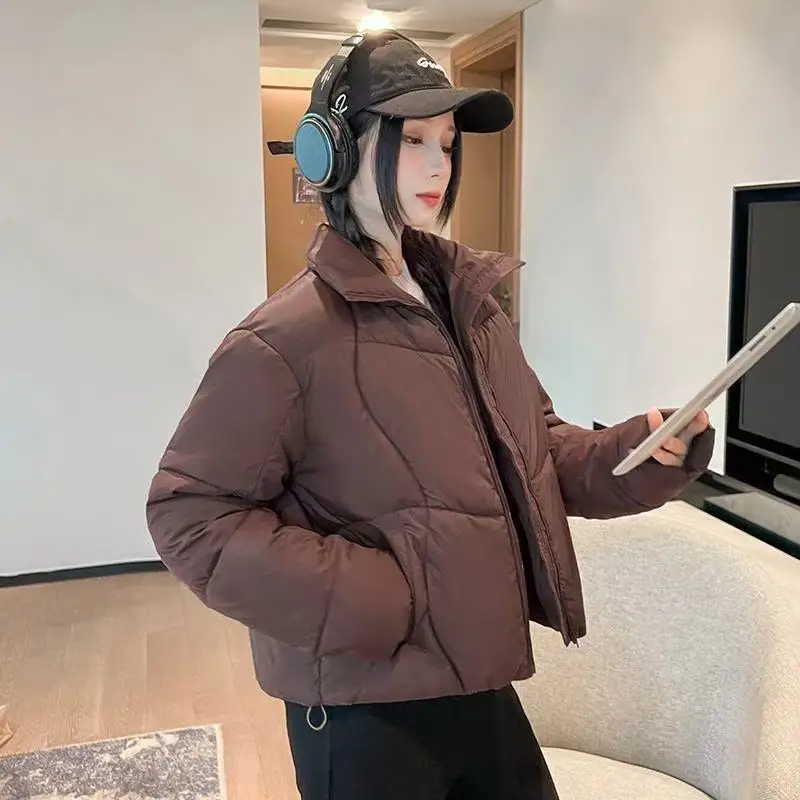 เสื้อโค้ทกันหนาวผู้หญิง แขนยาว คอตั้ง ทรงหลวม บุใยฝ้าย หนานุ่ม อุ่นสบาย สไตล์ลำลอง ปี 2025