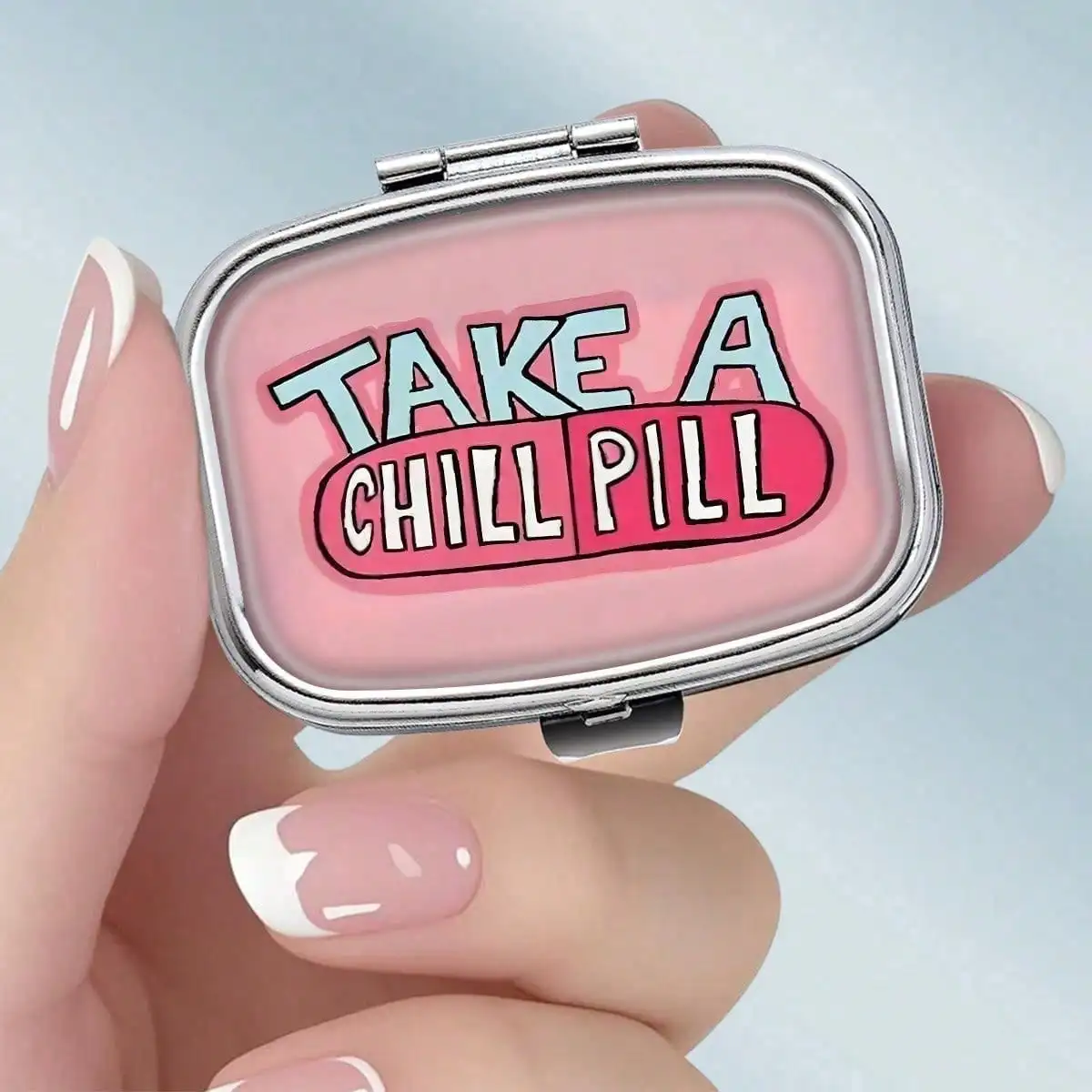 This Portable Square Metal Pill Box Features a Fun and Entertaining "Relaxation Pills" Theme Design. Dual-Compartment Design Allows You to Elegantly Store Your Medications or Health Supplements. It Is Also Very Suitable for Organizing Vitamins and Storing