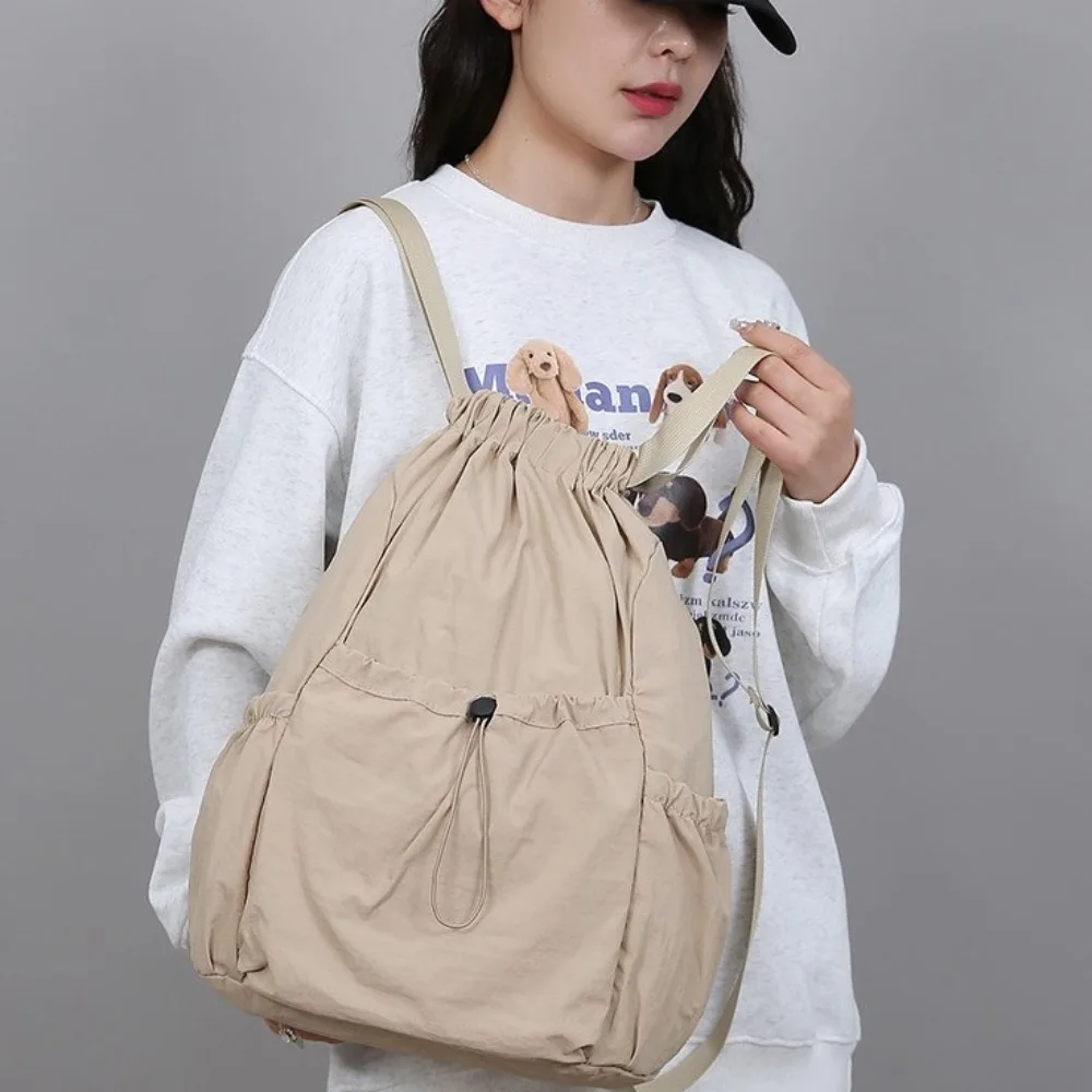 حقيبة ظهر كاجوال للسفر بلون سادة على الطراز الكوري حقيبة ظهر برباط خفيفة الوزن بسعة كبيرة وقابلة للطي حقيبة مدرسية للطلاب رياضية