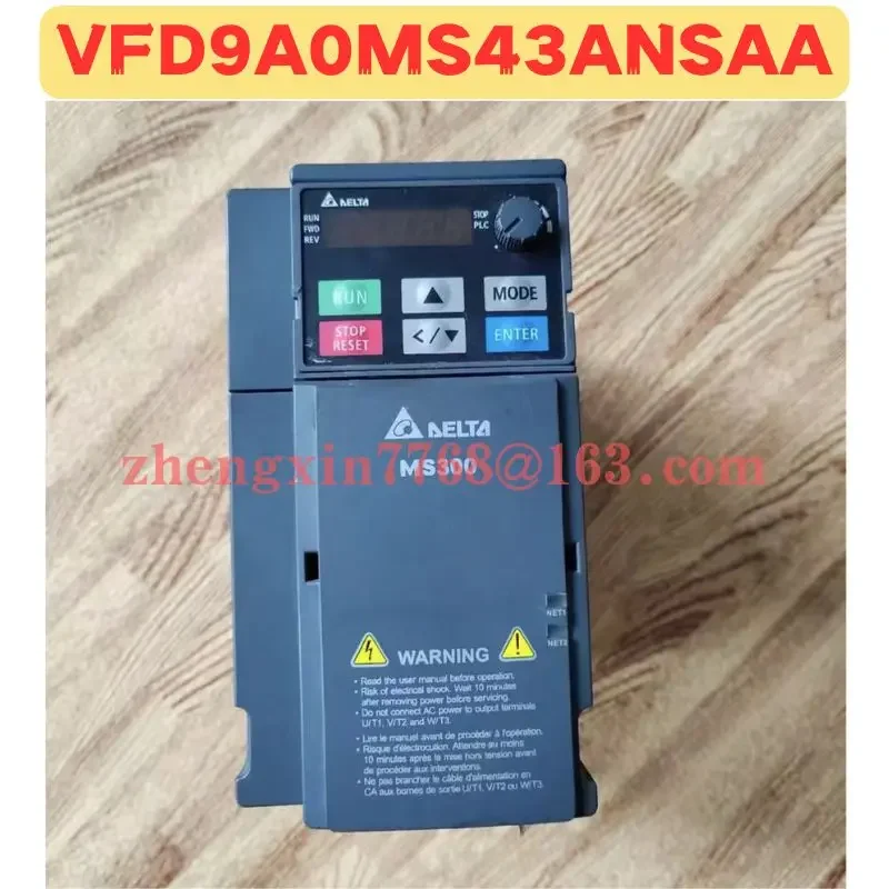 

Used Frequency Converter VFD9A0MS43ANSAA Normal Function Tested OK