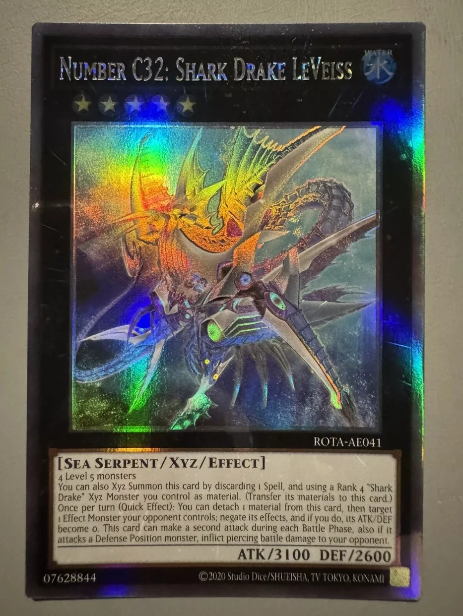 

Yugioh KONAMI ROTA-AE041 Number C32: Shark Drake LeVeiss Ghost Rare Holographic Asian English Collection Mint Card