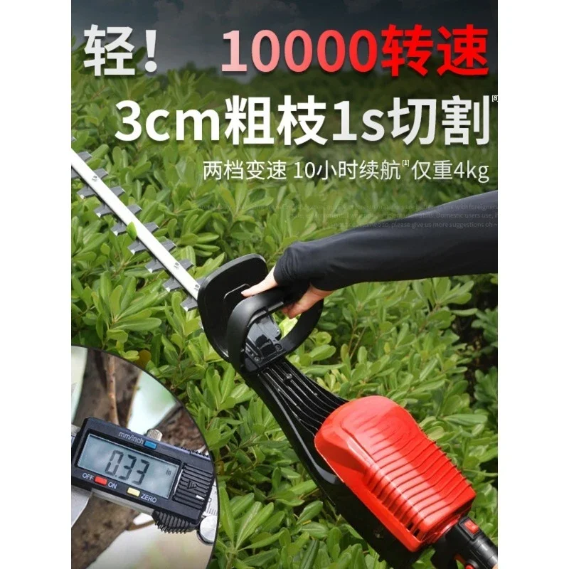 Electric hedge trimmer, tea garden pruner, fence thick branches pruning green shrubs