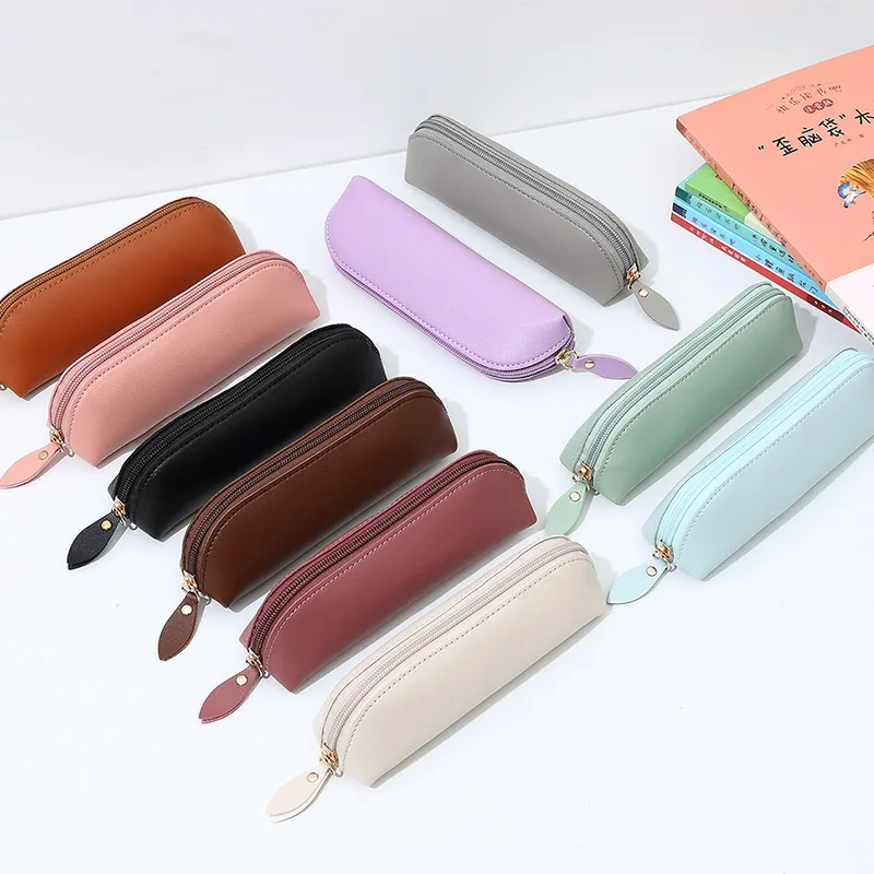 Un estuche creativo de cuero PU para bolígrafos con un diseño de cremallera y una bolsa de almacenamiento de cuero simple para aprender papelería