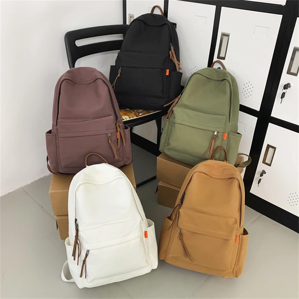 Mochila escolar para hombre y mujer, bolsa de viaje impermeable, bonita, de Color sólido, para estudiantes