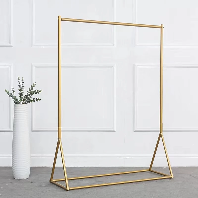 

Clothing store special display rack Floor-to-ceiling golden wrought iron shelf display children's clothing and women's