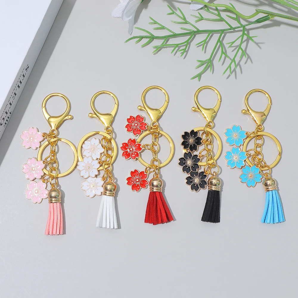 

Fashion Sakura Tassel Keyring Classic Alloy Flower Charms Purse Bag Decor Car Key Holder Key Ring Girls New Year Party Gifts
