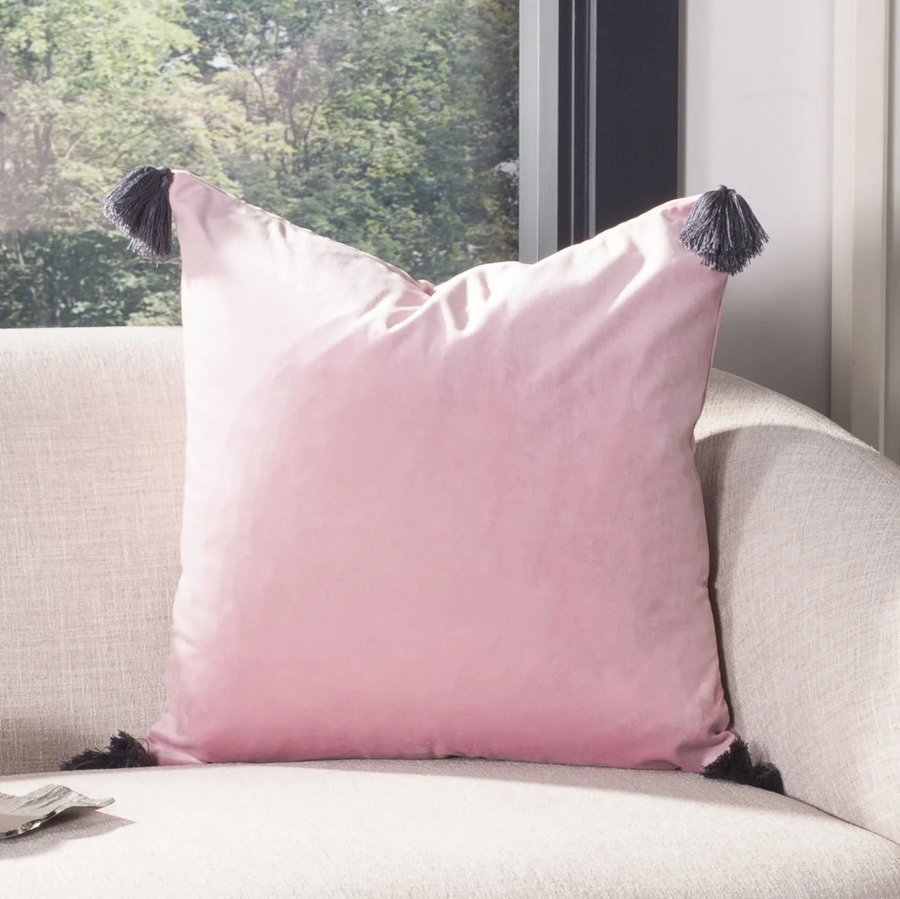 

Adelina 18x18 inch soft plush pillow featuring decorative tassel in pink tone