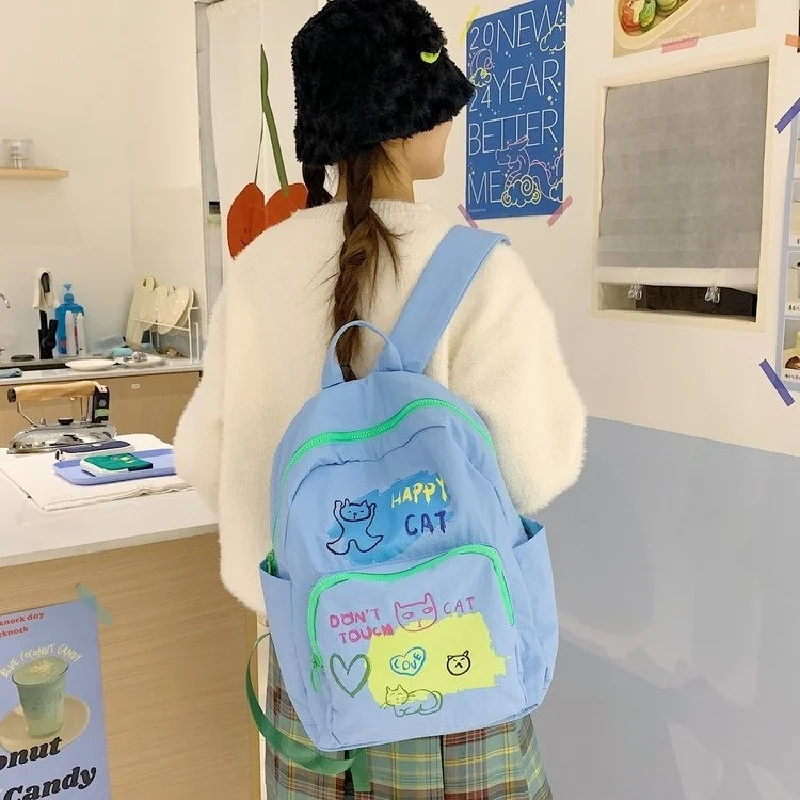 

Light Blue Cute Cat Print Backpack, Nylon School Bag with Green Zipper, Kawaii Cartoon Travel Backpack for Teen Girls Students