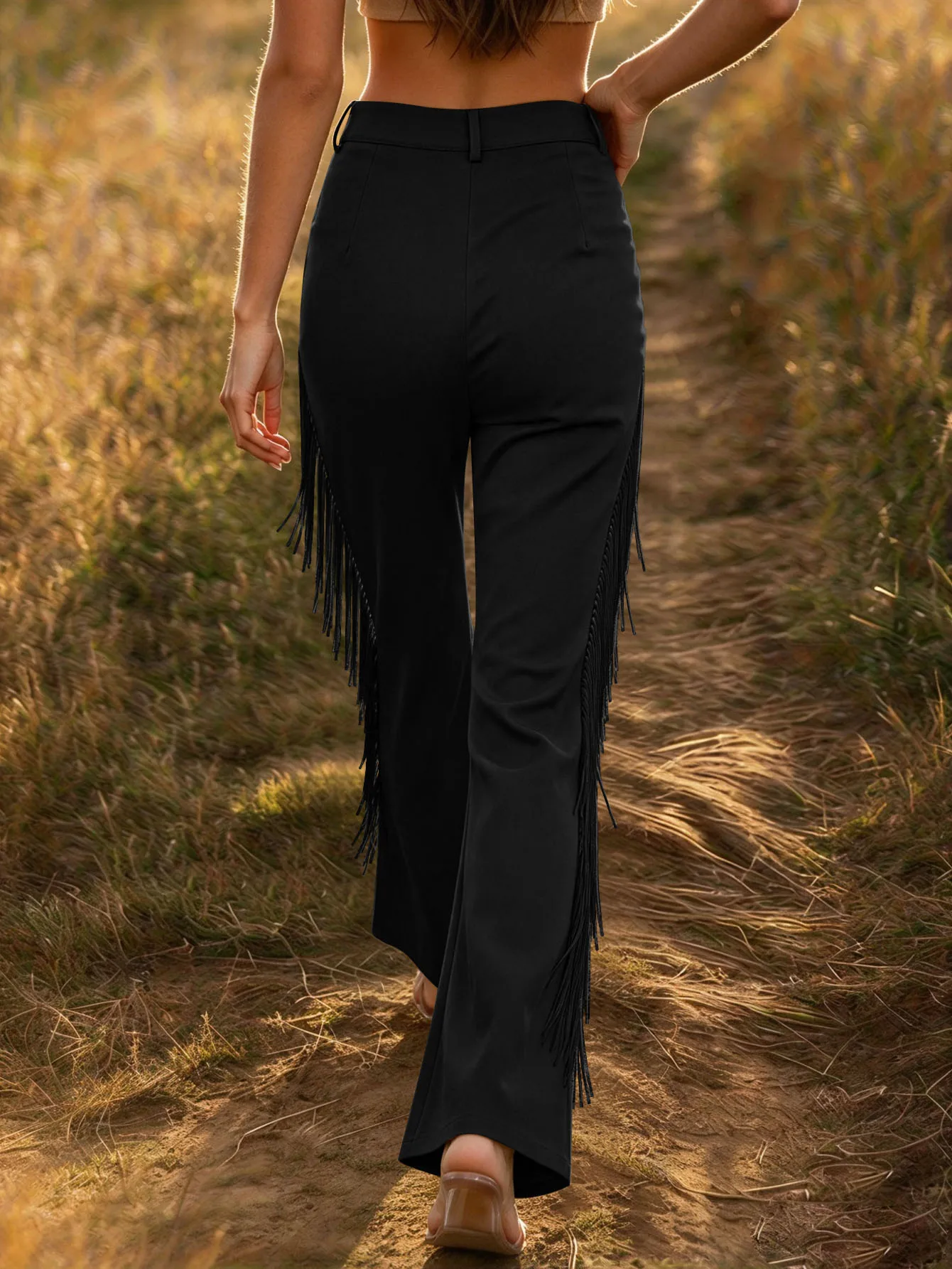 Ladies' high-waisted slim-fit flared trousers with side fringe embellishments.