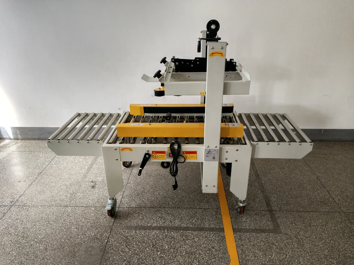 

Warehouse Packaging Semi Automatic Master Carton Box Plastic Adhesive Tape Sealer Case Sealing Machine