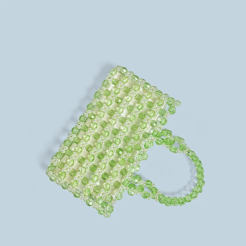 2025 صيف جديد الأخضر كريستال أكريليك اليدوية مطرز حقائب النساء العصرية عادية بلون اليد المنسوجة عطلة حقيبة حمل على الشاطئ حقيبة