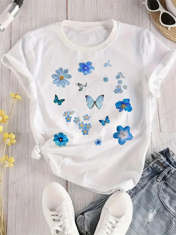 Camiseta de mariposa azul con flores voladoras para mujer, camiseta deportiva elegante con estampado, transpirable, ajuste cómodo, parte superior blanca perfecta para todas las estaciones