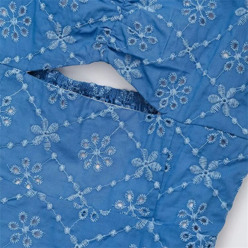 Keyanketian 2025 verão novo vestido feminino bordado deslizamento beachwear férias vento sem costas oco em camadas sem mangas mini vestido