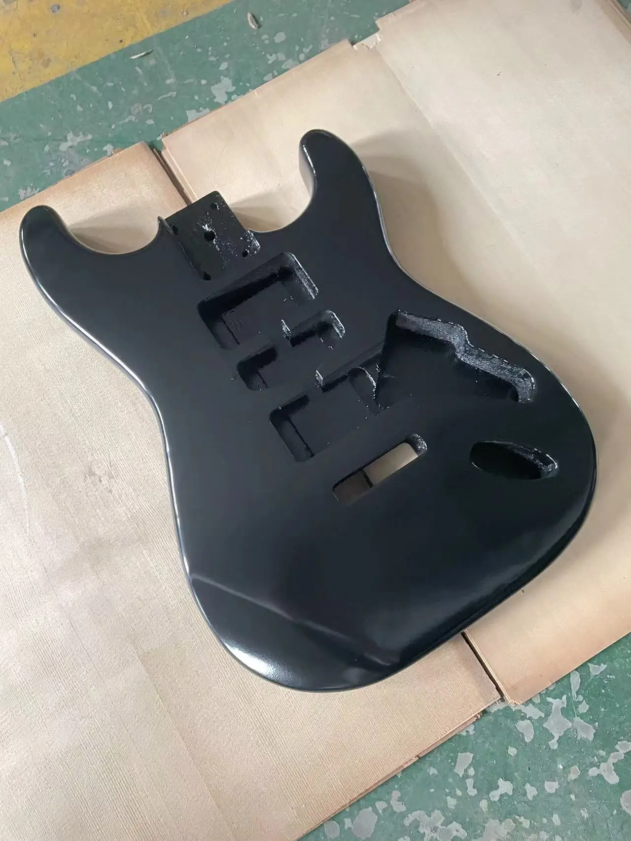 The black glossy guitar panel is an ST style electric guitar with a half empty heart barrel DIY guitar. The colored guitar body