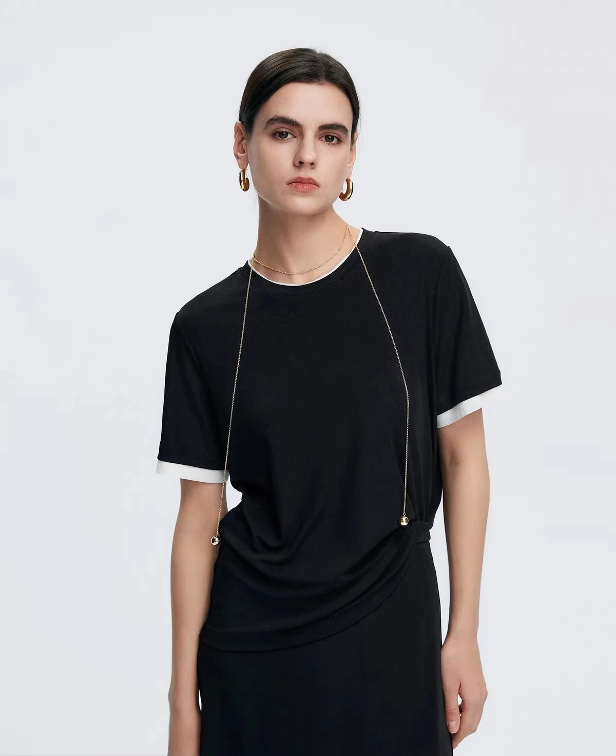 

Paper figure T-shirt skirt set female Spring 2025 Two fake T-shirts and A-line skirts have a drape that makes one look slimmer