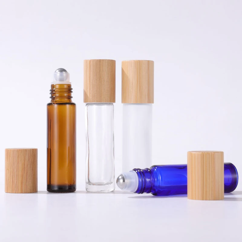 

Glass Essential Oil Roller Bottles 5ml 10ml Refillable Perfume Sample Vial 5ml Roll On Bottle with Bamboo Lid 50 pcs