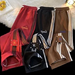 Pantalones de chándal deportivos a rayas para hombres y mujeres, pantalones sueltos casuales con bordado del alfabeto, tendencia Ins, pantalones de pareja arrastrados de Hong Kong