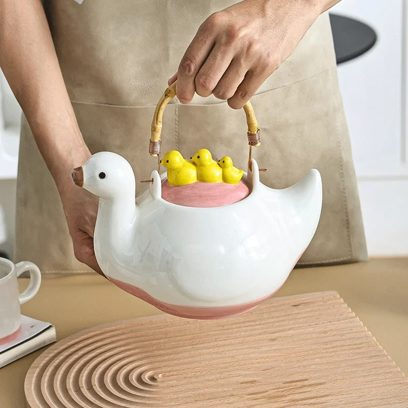 

Ceramic duck-shaped water kettle, a charmingly designed cool water jug, suitable for afternoon tea teapot and cups.