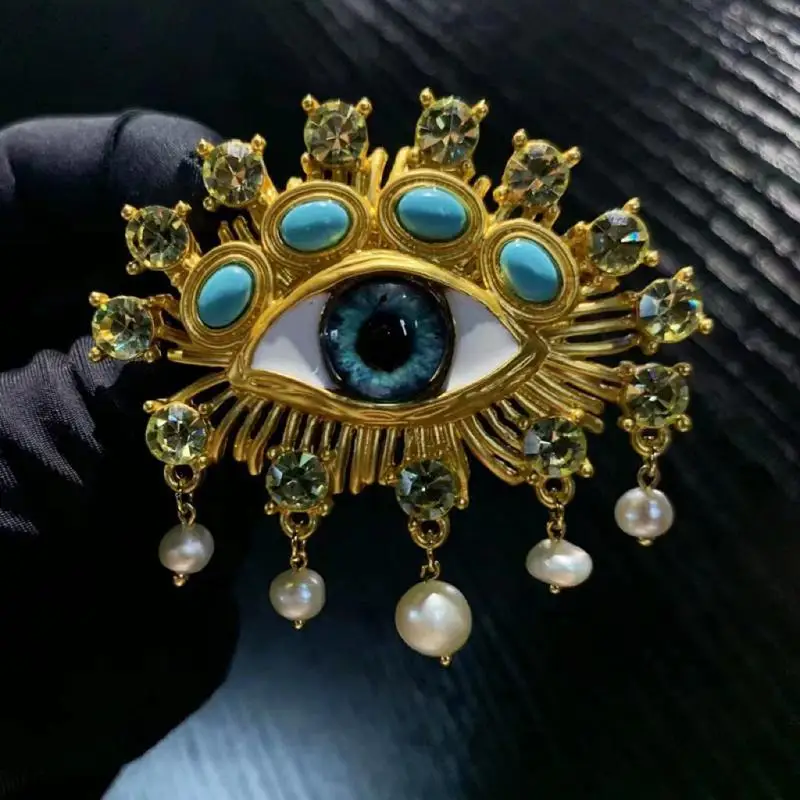 

Natural Baroque Pearl Tassel Female Style Eye Pin Brooch