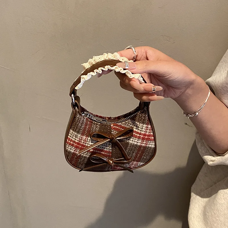 الخريف والشتاء الكورية باليد القوس حقيبة صغيرة للنساء 2026 جديد صغير رسول صغير وحساسة أحمر الشفاه تغيير حقيبة #1