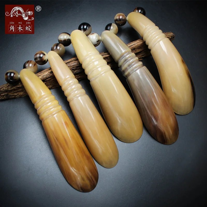 Made from hornwood yak horn, the gua sha roller and two-wheel massage cart