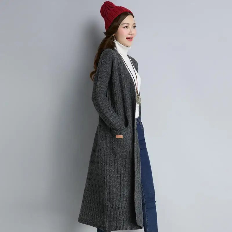 Autumn and winter new loose slimming mid length knitted jacket fashionable solid color long sleeved sweater cardigan outer outfi