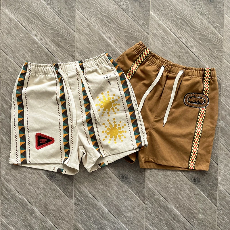 

Шорты Cactus Jack Starburst Jorts для мужчин и женщин, абрикосовые, коричневые, в красочную полоску, свободные шорты на шнурке