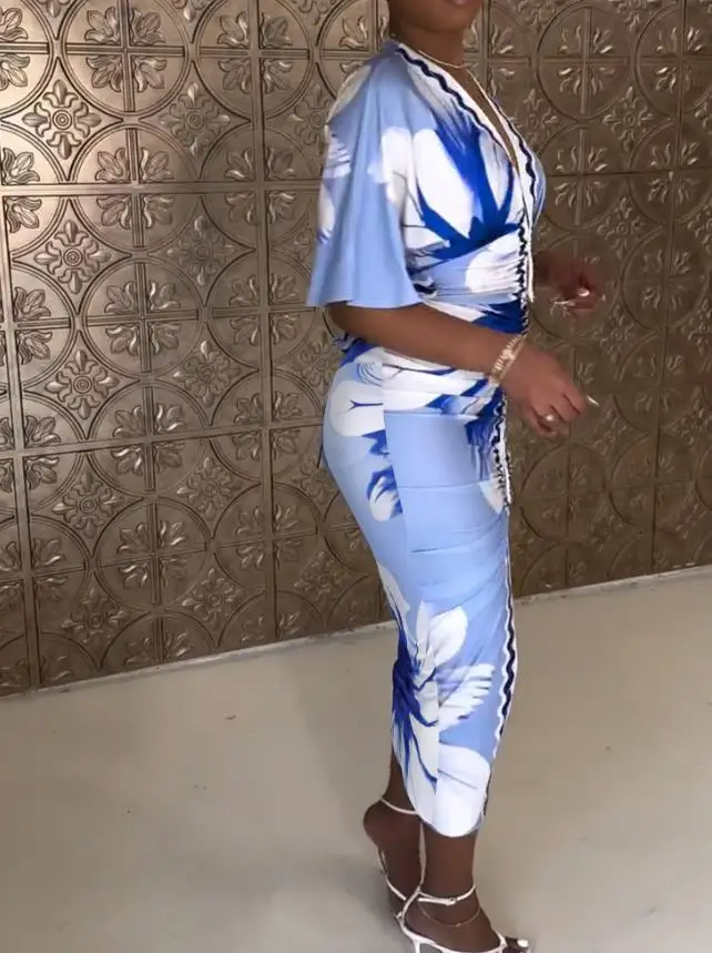 2025年春新作 レディース 花柄プリント プランジVネック ベルスリーブ ボディコンワンピース カジュアル スリムフィット スリット入りミディ丈ワンピース