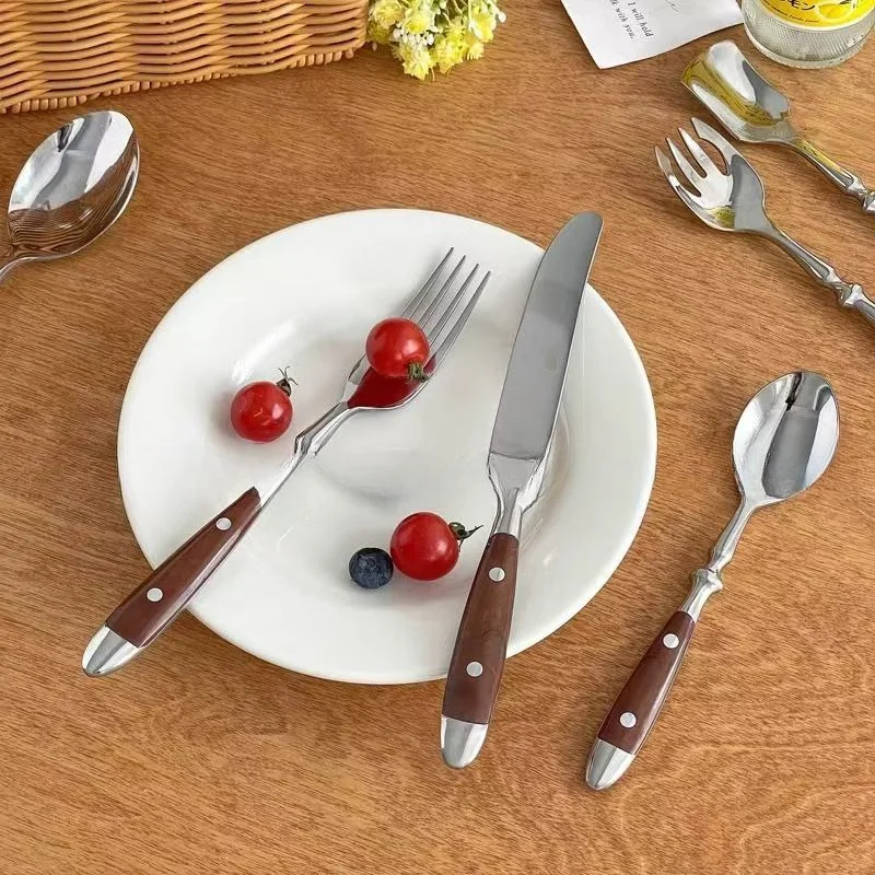 Stainless steel cutlery set with two nails, fork spoon, wooden handle, fork spoon, stainless steel three piece set