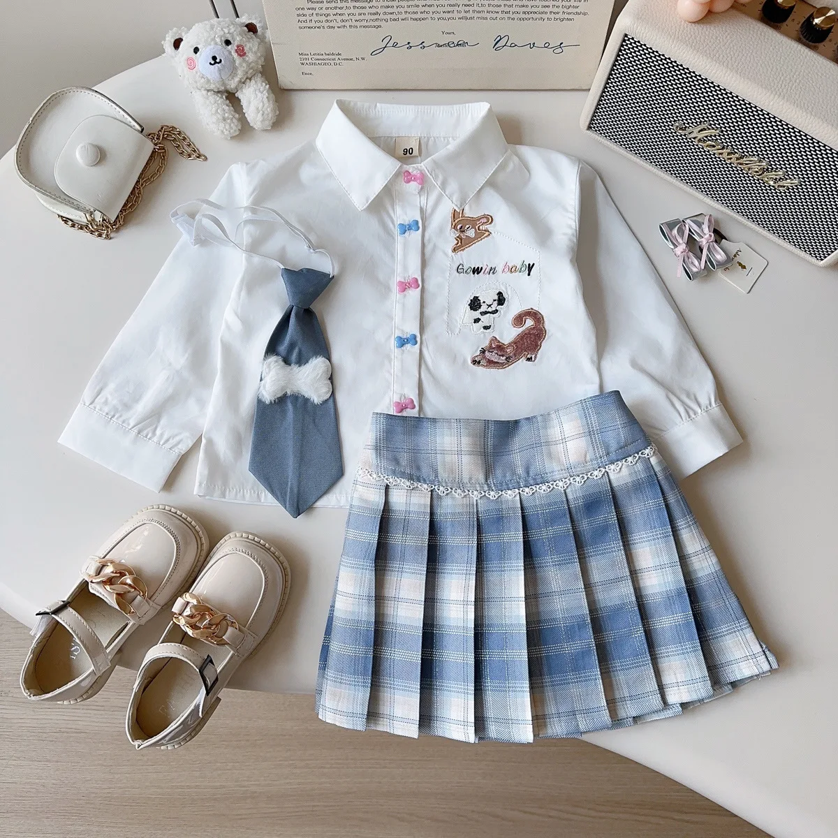 

Новый комплект школьного стиля для девочек, рубашка с вышивкой из мультфильма и плиссированная юбка, весенне-осенний комплект из двух предметов, детская униформа, платье