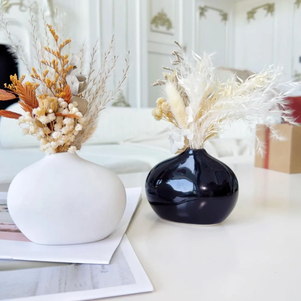 

A set of two black and white ceramic vases, cute oval ceramic vases, small modern home decoration vases