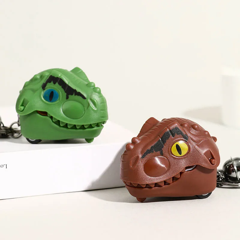 面白いクリエイティブな指噛み恐竜ヘッドおもちゃ車キーホルダーペンダント子供ギフトかわいい恐竜指噛みおもちゃプルバックカー