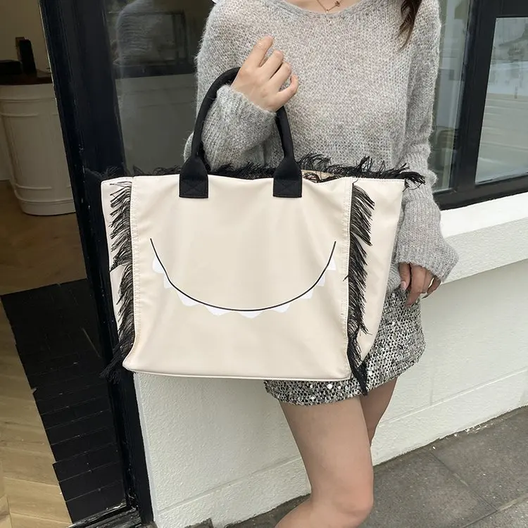 

New Korean Alphabet Canvas Bag Female Tassel Design Large Capacity Shoulder Tote Bag Student Commuting