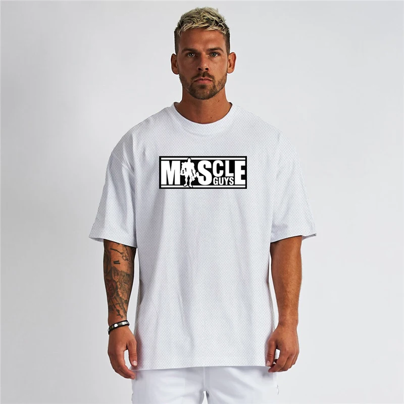 Oversized Loose Muscleguys Brand Tops Mens Loose Sports T-Shirts Summer Quick Dry Mesh Half Sleeve T Shirts Gym Fitness Clothing