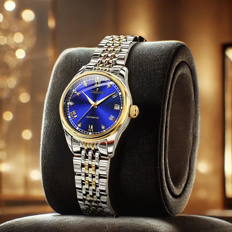 

Женский золотой стальной ремешок со стильным автоматическим механическим часами с синим циферблатом и датой.