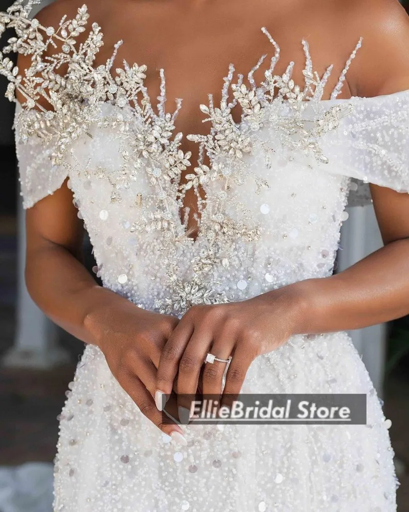 فساتين زفاف نيجيرية أنيقة فاخرة برقبة شفافة وكشكشة كريستالية ذيل حورية البحر الأفريقية مشد زي العرائس 2025 حسب الطلب