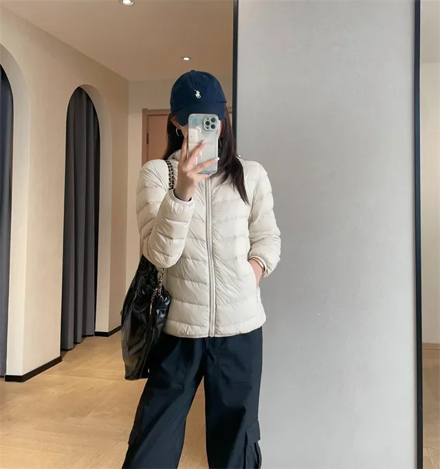 Giacca imbottita leggera da donna stile corto outdoor casual 90% piumino d'anatra bianca stile gilet tessuto in nylon chiusura con cerniera con cappuccio