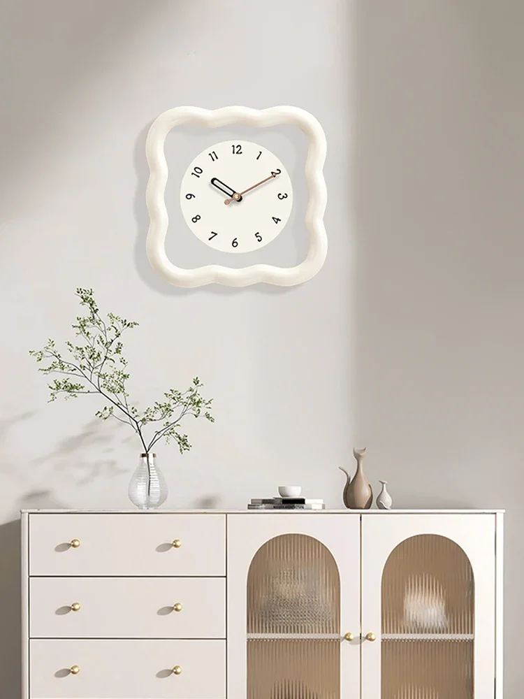 

Cream wind cookies living room wall clock 2023 new online celebrity creative clock silent clock wall simple and modern.