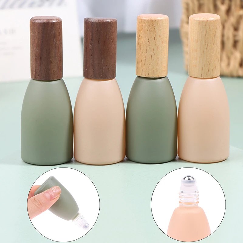 

10ml Glass Frosted Roll On Bottle Essential Oil Roller Bottles With Stainless Steel Roller Balls And Wooden Painted Lids Sample
