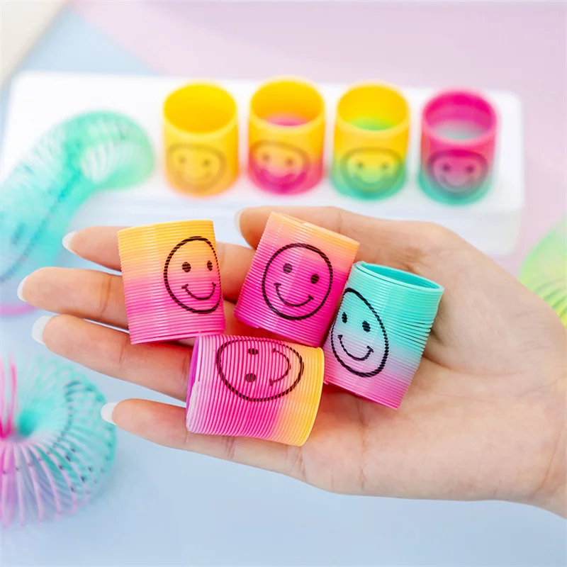 12Pcs Mini Smiley Gesicht Regenbogen Neon Magie Frühling Spielzeug Kinder Geburtstag Geschenke Baby Dusche Gäste Gastgeschenke Finger Spiel pinata Füllen