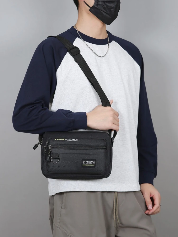 

Новая стильная и простая мужская сумка через плечо с защитой от брызг, вместительная сумка для деловых поездок и путешествий.