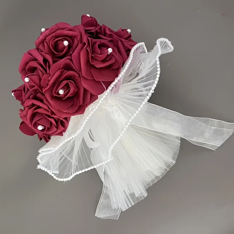 A wedding dress adorned with beautiful and captivating pearls, surrounded by rose-shaped artificial bouquets held in the hands