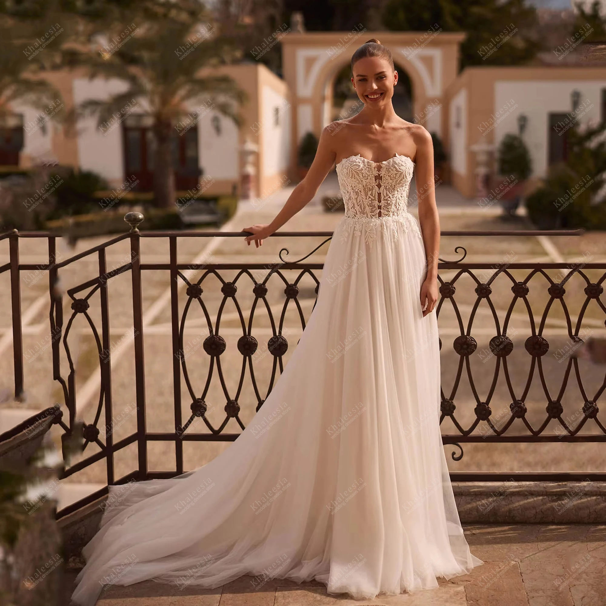 

Charming Wedding Dresses A Line Tulle Tiered Bridal Gowns Lace Appliques Strapless Backless Vestidos De Novia Customized 2026