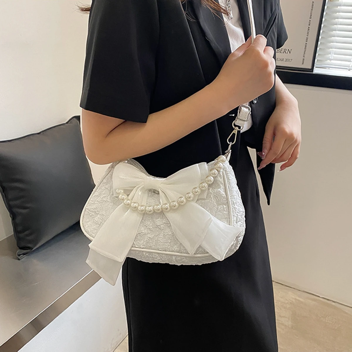 

White folds pop retro bow bag Female Pearl handle New fashion pearl armpit shoulder crossbody bag 1 outfit