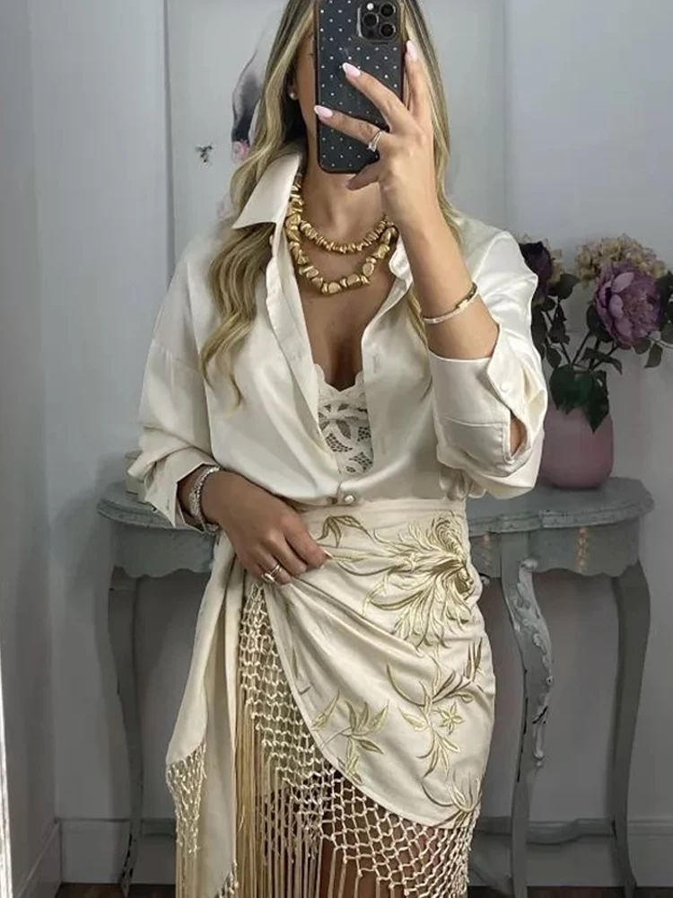 موضة شرابة المنسوجة ميدي تنورة المرأة أنيقة غير المتماثلة التجاعيد حزام أسفل 2025 جديد الصيف عطلة الشارع الشاطئ ملابس للسيدات